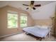 Upstairs bedroom featuring natural light, vaulted ceilings and neutral colors to make your own at 281 Laney Dr, Locust Grove, GA 30248