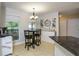 Eat in kitchen area with a breakfast table set and large window at 281 Laney Dr, Locust Grove, GA 30248