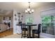 Breakfast nook featuring a black table, chairs, and a large window at 281 Laney Dr, Locust Grove, GA 30248