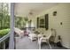 Relaxing front porch with wicker furniture, providing a cozy outdoor space at 281 Laney Dr, Locust Grove, GA 30248