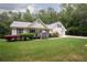 Charming home with a well-manicured lawn and beautiful landscaping at 281 Laney Dr, Locust Grove, GA 30248