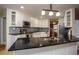 Kitchen featuring white cabinets, stainless steel appliances, and dark countertops at 281 Laney Dr, Locust Grove, GA 30248