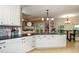 Kitchen featuring white cabinets, island and dark countertops at 281 Laney Dr, Locust Grove, GA 30248