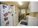 Bright laundry room includes washer, dryer, and lots of cabinet storage space for convenience at 281 Laney Dr, Locust Grove, GA 30248