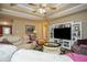 Comfortable living room featuring a large entertainment center and a neutral color palette at 281 Laney Dr, Locust Grove, GA 30248