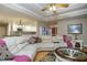 Inviting living room featuring hardwood floors, a coffered ceiling, and access to the open-concept kitchen at 281 Laney Dr, Locust Grove, GA 30248
