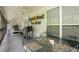 Entertaining screened porch featuring dining, grill, and lounge areas for hosting outdoor gatherings with ease at 281 Laney Dr, Locust Grove, GA 30248