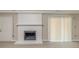 Basement features a painted brick fireplace, and sliding doors leading to the outside at 5845 Highway 92, Fairburn, GA 30213