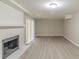 Basement features a painted brick fireplace, and sliding doors leading to the outside at 5845 Highway 92, Fairburn, GA 30213
