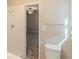 Bright, tiled bathroom and standing shower, with access to an adjacent bedroom at 5845 Highway 92, Fairburn, GA 30213