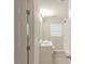 A modern bathroom featuring a white vanity and a glass-enclosed shower at 5845 Highway 92, Fairburn, GA 30213