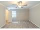 Carpeted bedroom featuring ceiling fan, and one window. Closet to the left at 5845 Highway 92, Fairburn, GA 30213