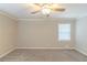 A calming bedroom showcasing a neutral color scheme, soft carpeting, and a window for natural light at 5845 Highway 92, Fairburn, GA 30213