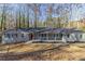Charming ranch-style home with a welcoming porch and mature trees in a peaceful neighborhood at 5845 Highway 92, Fairburn, GA 30213