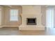 Living room featuring fireplace, gray walls, and neutral flooring at 5845 Highway 92, Fairburn, GA 30213