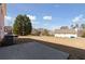 Spacious backyard featuring a patio, perfect for outdoor activities and enjoying the serene surroundings at 6844 Cavalier Ct, Stone Mountain, GA 30087