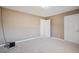 Neutral bedroom featuring carpet floors, base molding and two closets at 6844 Cavalier Ct, Stone Mountain, GA 30087