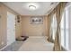 Bedroom space with neutral carpet, light fixtures and decor at 6844 Cavalier Ct, Stone Mountain, GA 30087