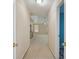 Inviting hallway leading to an open living area with plenty of natural light at 6844 Cavalier Ct, Stone Mountain, GA 30087