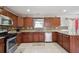 Kitchen features stainless steel appliances, granite countertops, and mosaic tile backsplash at 6844 Cavalier Ct, Stone Mountain, GA 30087