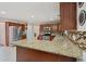 A spacious kitchen featuring granite countertops and stainless steel appliances at 6844 Cavalier Ct, Stone Mountain, GA 30087