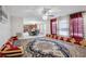 Open concept living room and dining area with unique floor seating and modern light fixture at 6844 Cavalier Ct, Stone Mountain, GA 30087