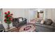 Open-concept living space with unique floor seating, traditional furniture, and vibrant floral decor at 6844 Cavalier Ct, Stone Mountain, GA 30087
