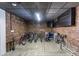Basement bike storage room with exposed brick walls and wood flooring at 1116 Piedmont Ne Ave # 12, Atlanta, GA 30309