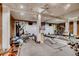 Basement gym area with exposed brick, mirrored wall, and workout equipment at 1116 Piedmont Ne Ave # 12, Atlanta, GA 30309