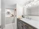 Stylish bathroom featuring a dark wood vanity, marble countertop, and decorative wall details at 1116 Piedmont Ne Ave # 12, Atlanta, GA 30309