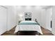 Cozy bedroom featuring modern decor, wood-look flooring, and ample natural light at 1116 Piedmont Ne Ave # 12, Atlanta, GA 30309