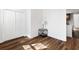 Bedroom with wood-look floors, closet, and modern side table at 1116 Piedmont Ne Ave # 12, Atlanta, GA 30309