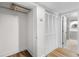 Walk-in closet with shelving and louvered doors adjacent to a bright bathroom at 1116 Piedmont Ne Ave # 12, Atlanta, GA 30309