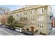 Attractive apartment building featuring an entrance with a red door and street parking at 1116 Piedmont Ne Ave # 12, Atlanta, GA 30309