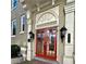 Stunning red double front door with decorative transom and sconces, adding charm and curb appeal at 1116 Piedmont Ne Ave # 12, Atlanta, GA 30309