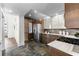 Modern kitchen featuring stainless steel appliances, stone counters, and exposed brick, perfect for culinary enthusiasts at 1116 Piedmont Ne Ave # 12, Atlanta, GA 30309