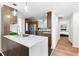Well-designed kitchen with island, quartz countertops, stainless steel appliances and wood cabinets at 1116 Piedmont Ne Ave # 12, Atlanta, GA 30309