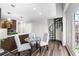 Charming kitchen boasts stainless appliances, pendant lighting, and a spiral staircase to upper level at 1116 Piedmont Ne Ave # 12, Atlanta, GA 30309