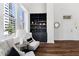 Comfortable sitting area with a built in bookshelf and plenty of natural light from large windows at 1116 Piedmont Ne Ave # 12, Atlanta, GA 30309