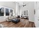 Bright, spacious living room with hardwood floors, high ceilings and large windows offering city views at 1116 Piedmont Ne Ave # 12, Atlanta, GA 30309