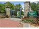The entrance to Piedmont Park is marked with stone pillars, wrought iron gates, and colorful flowers at 1116 Piedmont Ne Ave # 12, Atlanta, GA 30309