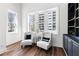 Inviting sitting room with natural light, hardwood floors and sophisticated decor and city views at 1116 Piedmont Ne Ave # 12, Atlanta, GA 30309