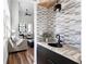 Stylish wet bar with modern fixtures and accent tile, ideal for entertaining guests at 1116 Piedmont Ne Ave # 12, Atlanta, GA 30309