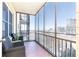 Balcony with city view and patio chairs at 300 W Peachtree St # 8C, Atlanta, GA 30308