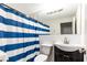Bathroom featuring a blue and white striped shower curtain at 300 W Peachtree St # 8C, Atlanta, GA 30308