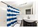 Bathroom featuring a blue and white striped shower curtain at 300 W Peachtree St # 8C, Atlanta, GA 30308