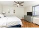 Cozy bedroom with neutral decor, a dresser with TV, and a calming ambiance for rest and relaxation at 300 W Peachtree St # 8C, Atlanta, GA 30308