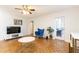 Bright living room featuring parquet floors, and access to a balcony with outside seating at 300 W Peachtree St # 8C, Atlanta, GA 30308
