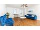 Comfortable living room boasting hardwood floors, plush seating, and a welcoming atmosphere at 300 W Peachtree St # 8C, Atlanta, GA 30308
