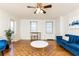 Cozy living room offering hardwood floors, comfortable seating, and natural light from the windows at 300 W Peachtree St # 8C, Atlanta, GA 30308